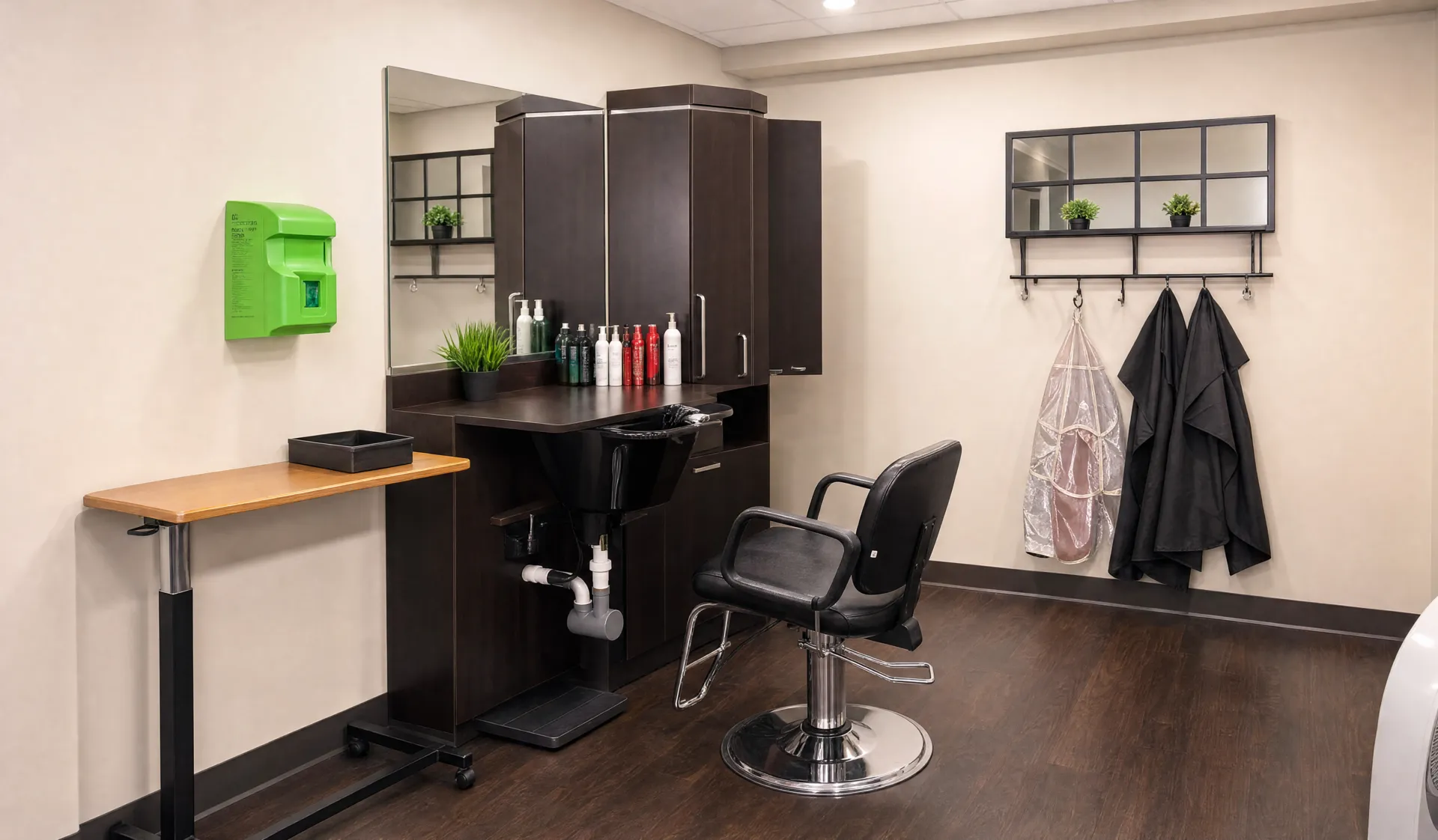Beauty salon with a styling chair, mirror and cabinets at Nora Springs Care Center