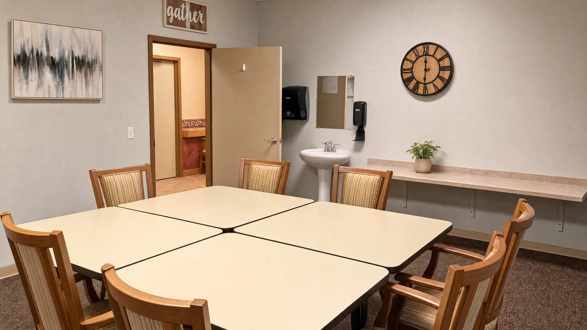 Private meeting and dining room with tables, chairs and a sink at Nora Springs Care Center