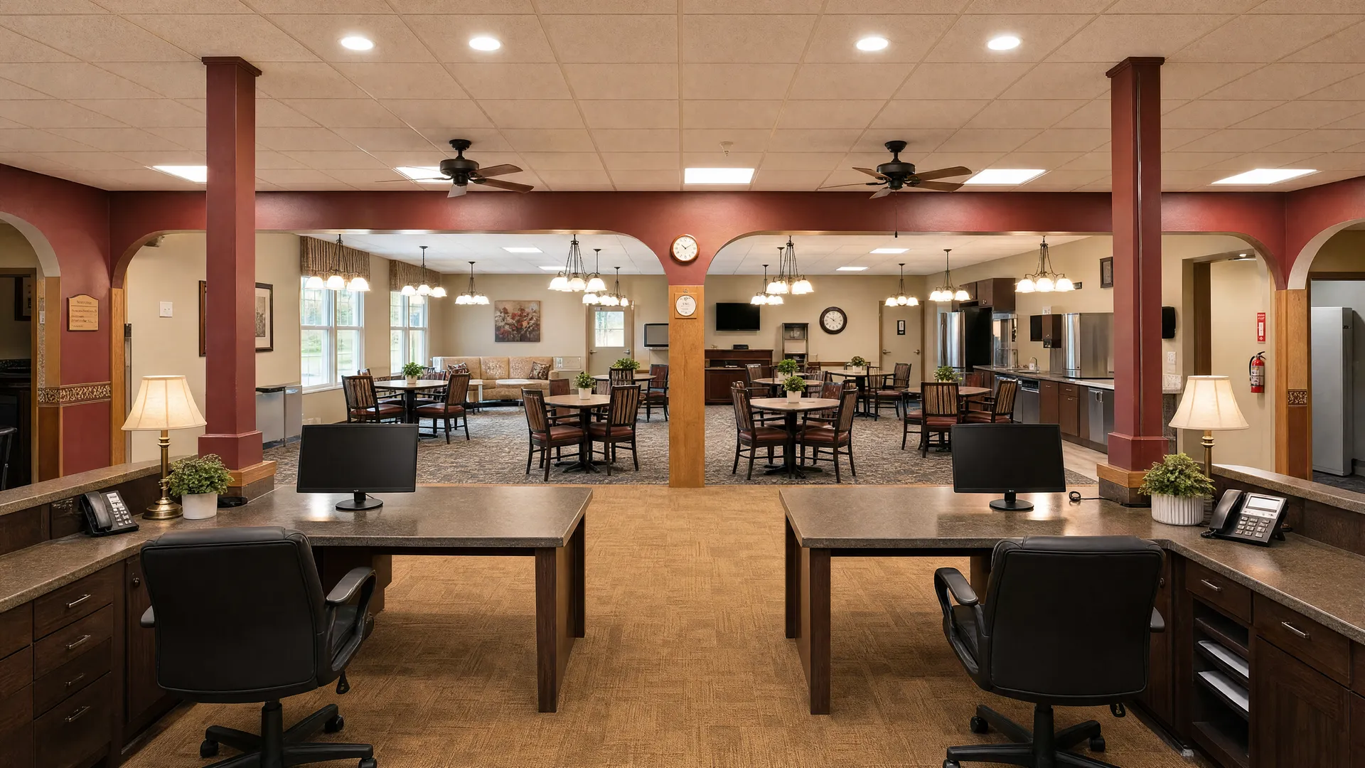 Dining room with a serving counter and arched columns at Nora Springs Care Center